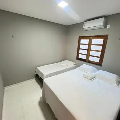 Uma cama ou camas num quarto em Casa com 3 dormitórios na Praia do Preá com Piscina