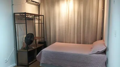 Uma cama ou camas num quarto em Flat Aconchego Beira Mar