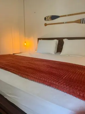 Uma cama ou camas num quarto em Grand VillaBlue pousada boutique Icaraizinho