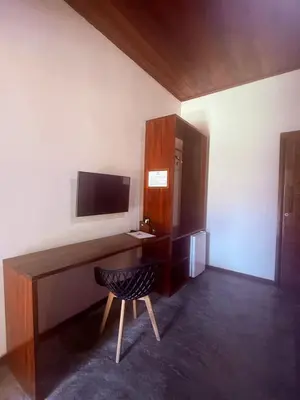 Uma televisão e/ou sistema de entretenimento em Grand VillaBlue pousada boutique Icaraizinho