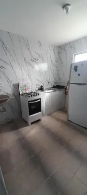 A cozinha ou kitchenette de APARTAMENTO COM PISCINA 500mt DA PRAIA e 10 MINUTOS DE CUMBUCO