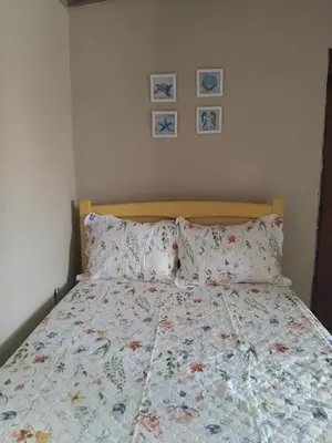Uma cama ou camas num quarto em Casa Jaya