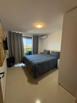 Uma cama ou camas num quarto em Oásis Cumbuco Residence