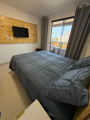 Uma cama ou camas num quarto em Oásis Cumbuco Residence