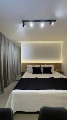 Uma cama ou camas num quarto em Studio completo a passos da Beira Mar no Meireles