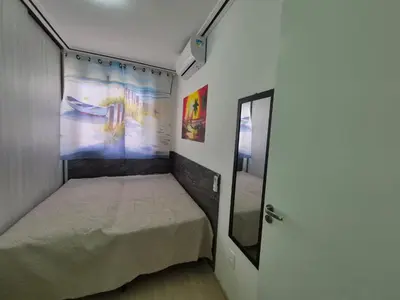 Uma cama ou camas num quarto em Estilo Dunas Residence Lazer & Vista Mar
