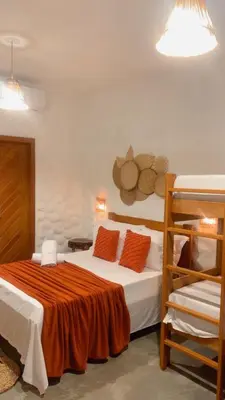 Uma cama ou camas num quarto em Chalé Brisa do Pontal