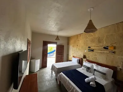 Uma cama ou camas num quarto em Chalé Brisa do Pontal