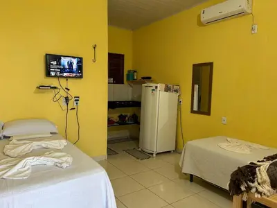 Uma cama ou camas num quarto em Chalé brisa do mar