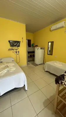 Uma cama ou camas num quarto em Chalé brisa do mar