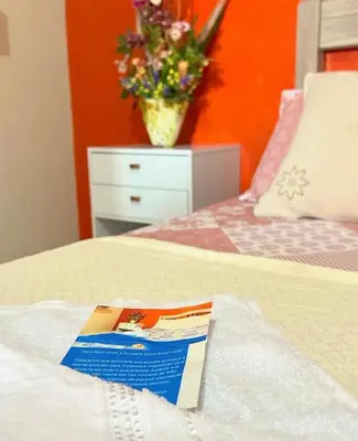 Uma cama ou camas num quarto em Pousada Novo Amanhecer