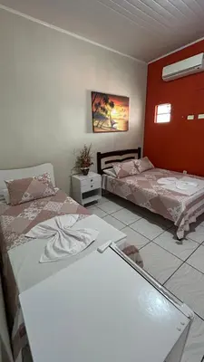Uma cama ou camas num quarto em Pousada Novo Amanhecer