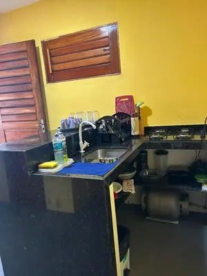 A cozinha ou kitchenette de Chalés brisa do mar