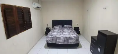 Uma cama ou camas num quarto em Casa de praia de frente para o mar