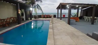 A piscina em ou perto de Casa de praia de frente para o mar