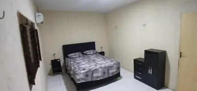 Uma cama ou camas num quarto em Casa de praia de frente para o mar
