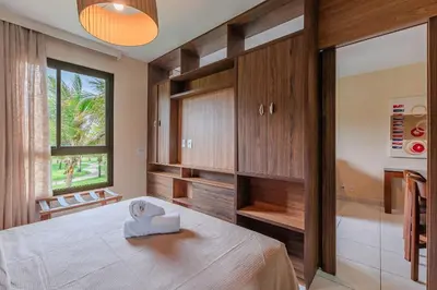 Uma cama ou camas num quarto em VG Sun #206 Beira Mar no Cumbuco By Carpediem