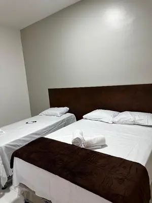 Uma cama ou camas num quarto em Hotel complexo paris