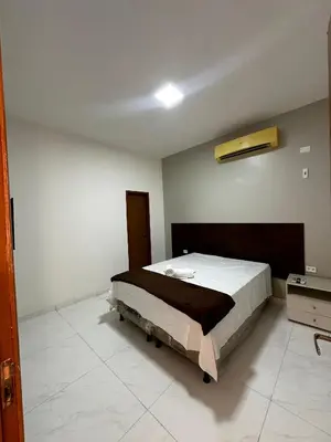 Uma cama ou camas num quarto em Hotel complexo paris