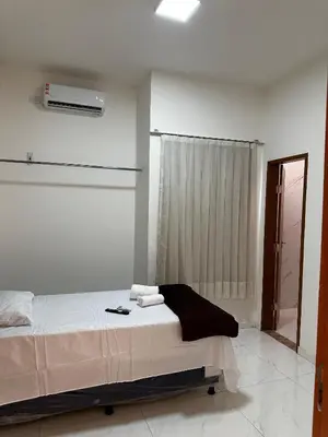 Uma cama ou camas num quarto em Hotel complexo paris