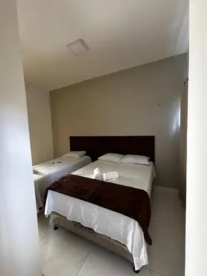Uma cama ou camas num quarto em Hotel complexo paris