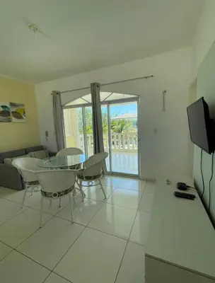 Uma televisão e/ou sistema de entretenimento em Apartamento 218, primeiro andar, Canoa Quebrada