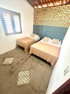 Uma cama ou camas num quarto em Chalé Vila da Volta