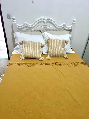 Uma cama ou camas num quarto em Chalé Vila da Volta