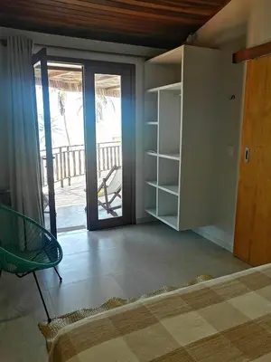 Uma cama ou camas num quarto em Vila Refúgio