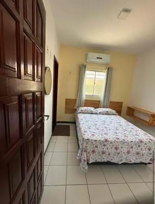 Uma cama ou camas num quarto em Apartamento Amarelinho - Canoa Quebrada