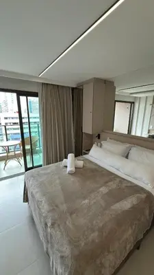 Uma cama ou camas num quarto em Apartamento studio novo completo - Beach Class Meireles