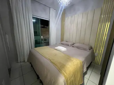 Uma cama ou camas num quarto em Casa Maia Eusébio