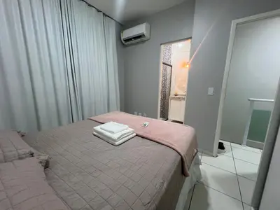 Uma cama ou camas num quarto em Casa Maia Eusébio
