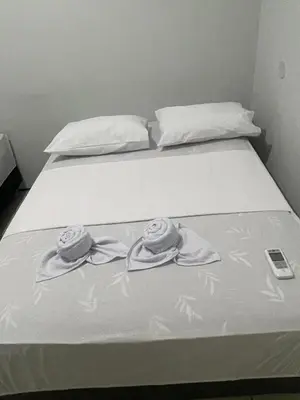 Uma cama ou camas num quarto em Pousada Casa Bali