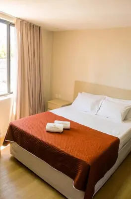 Uma cama ou camas num quarto em Hotel Vistta Iracema