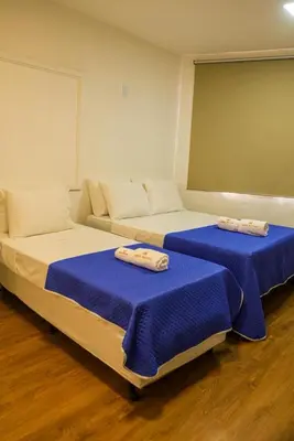 Uma cama ou camas num quarto em Hotel Vistta Iracema