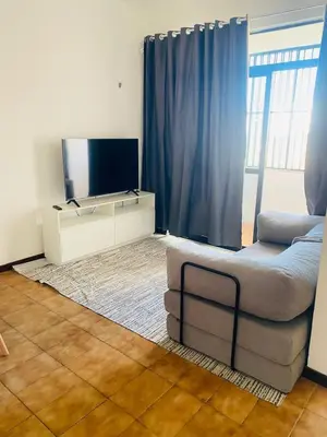 Uma televisão e/ou sistema de entretenimento em Apartamento completo para familia com dois quartos 304