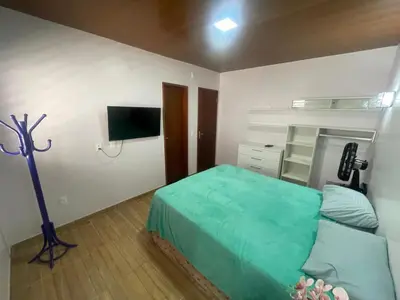 Uma cama ou camas num quarto em Recanto do Céu