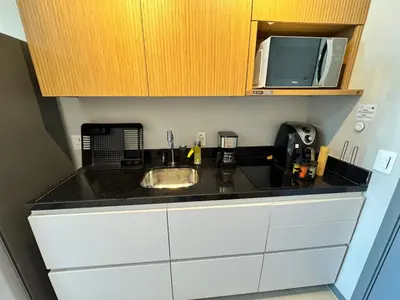 A cozinha ou kitchenette de Studio 500m da Praia - Piscina com Vista Incrível