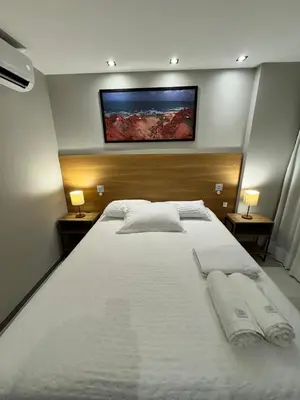 Uma cama ou camas num quarto em Studio 500m da Praia - Piscina com Vista Incrível