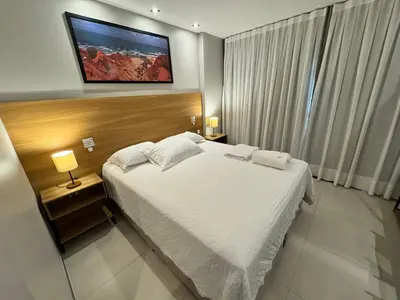 Uma cama ou camas num quarto em Studio 500m da Praia - Piscina com Vista Incrível
