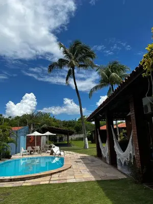 A piscina em ou perto de Pousada Brisa do Oceano Cumbuco - Quartos privativos e acomodações compartilhadas