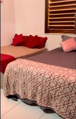 Uma cama ou camas num quarto em Aconchego Feliz