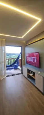 Uma televisão e/ou sistema de entretenimento em Vg Sun Cumbuco Beach House