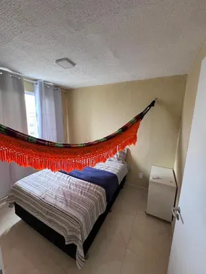 Uma cama ou camas num quarto em Apartamento pé na areia- Praia do futuro