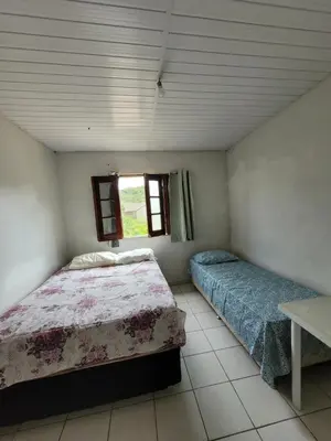 Uma cama ou camas num quarto em Sítio Guanabara