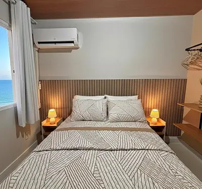 Uma cama ou camas num quarto em Apartamento Pé na Areia Praia do Futuro Fortaleza