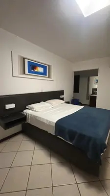 Uma cama ou camas num quarto em Casa Kite Academy