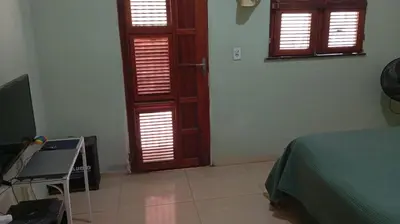 Uma televisão e/ou sistema de entretenimento em Casa do Sol Nascente em Aguas Belas CE