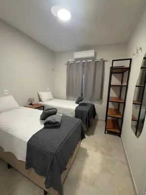 Uma cama ou camas num quarto em Sunset House Canoa Quebrada